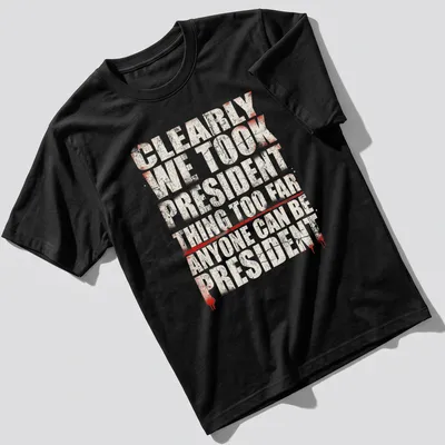 Grunge-style political humor t-shirt with bold text in red, white, and black
