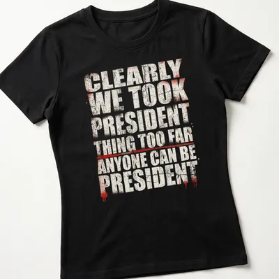 Grunge-style political humor t-shirt with bold text in red, white, and black — printed on a women's shirt