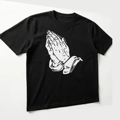 White text art of praying hands with the phrase 'Pray for me as I pray for you' — printed on a unisex t-shirt (angled view)