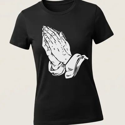White text art of praying hands with the phrase 'Pray for me as I pray for you' — printed on a women's shirt