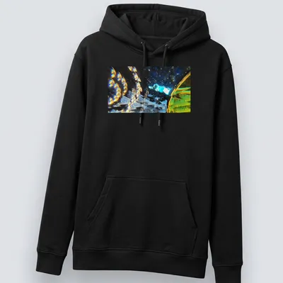 Abstract design featuring the phrase 'Stellar Odyssey Crossing The Prismatic Void' with vibrant colors. — printed on a unisex hoodie