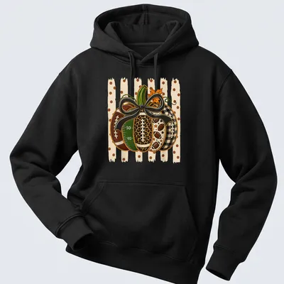Colorful illustration of a pumpkin with footballs and bow in autumn hues — printed on a unisex hoodie