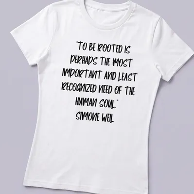 Handwritten Simone Weil quote about being rooted in black ink on white — printed on a women's shirt
