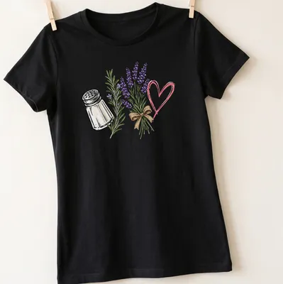 Illustrative T-shirt featuring a salt shaker and lavender flowers with a humorous quote about spilled salt. — printed on a women's shirt