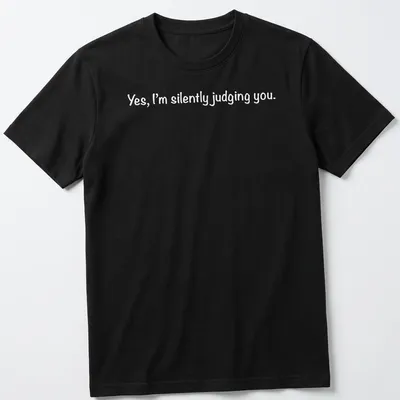 White t-shirt with a playful print stating 'Yes, I'm silently judging you.'