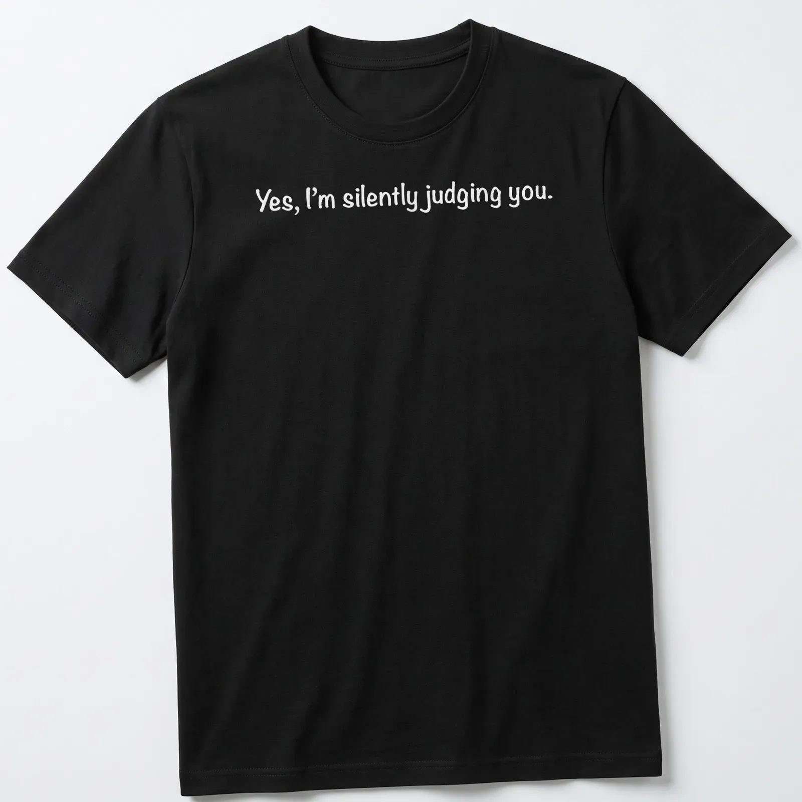 White t-shirt with a playful print stating 'Yes, I'm silently judging you.' — printed on a unisex t-shirt