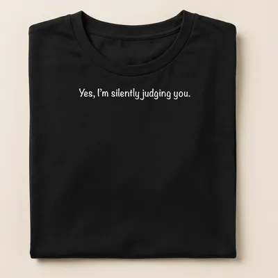 White t-shirt with a playful print stating 'Yes, I'm silently judging you.' — printed on a women's shirt