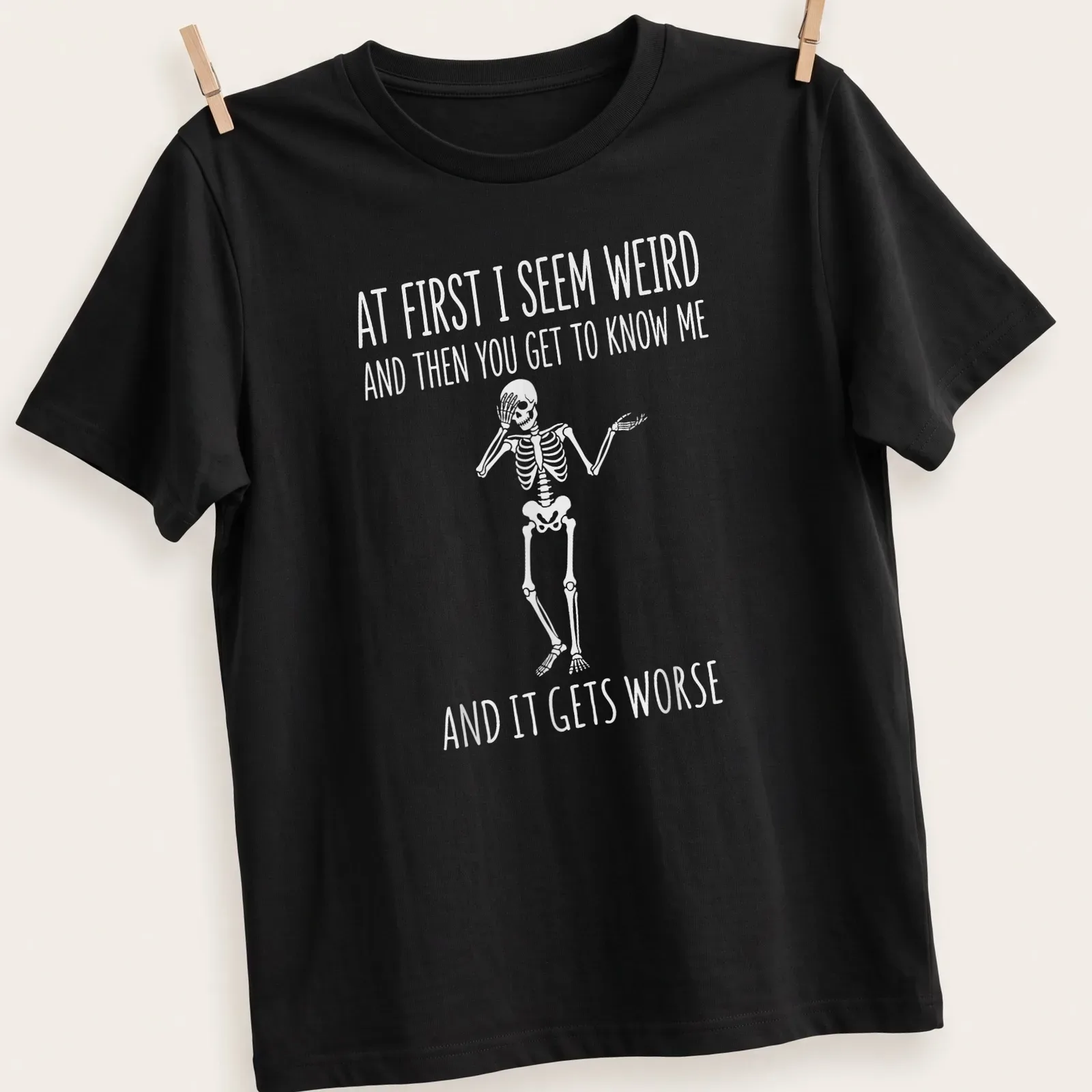 Playful cartoon skeleton t-shirt with humorous text about personality quirks — printed on a unisex t-shirt