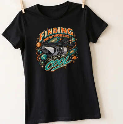 Vintage retro shirt featuring a space telescope and colorful text about finding new worlds — printed on a women's shirt