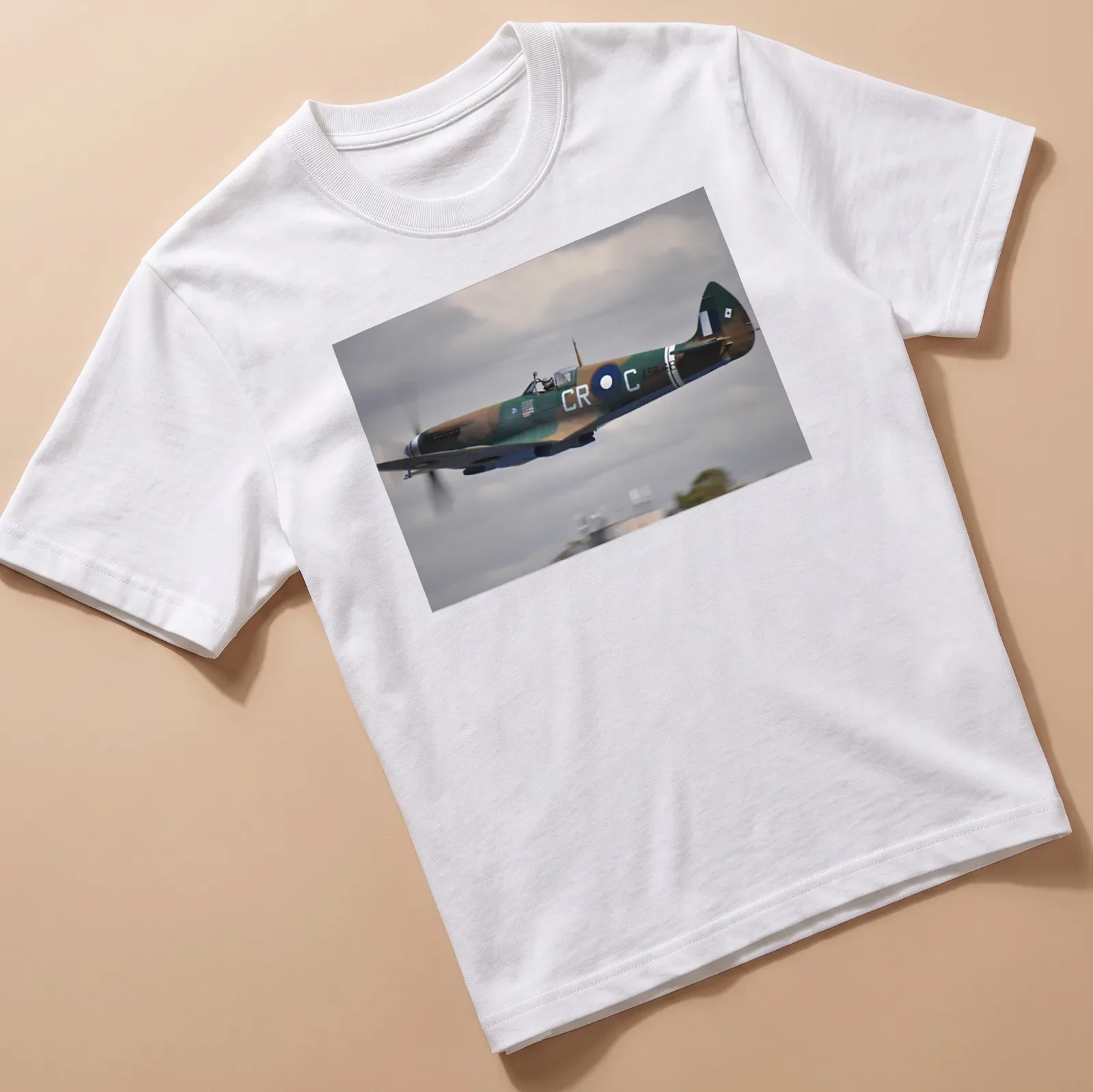 Photographic print of a Spitfire aircraft in flight with detailed colors — printed on a unisex t-shirt