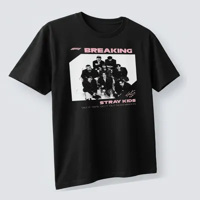 Monochrome shirt featuring Stray Kids graphic and text in black, white, and pink — printed on a unisex t-shirt (angled view)