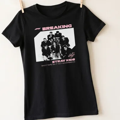 Monochrome shirt featuring Stray Kids graphic and text in black, white, and pink — printed on a women's shirt