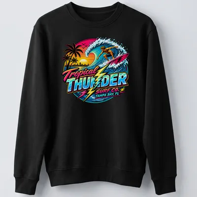 Vibrant retro print of a surfer with Tropical Thunder Surf Co. text — printed on a unisex sweatshirt