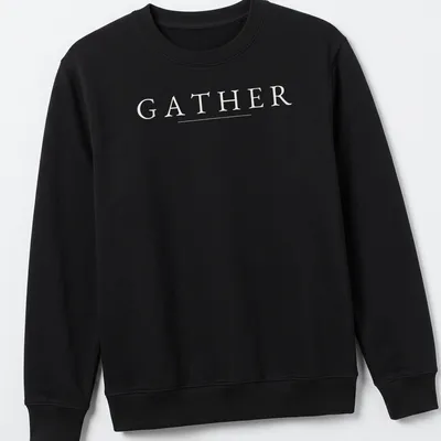 Minimalist Thanksgiving t-shirt with the word GATHER in white typography — printed on a unisex sweatshirt