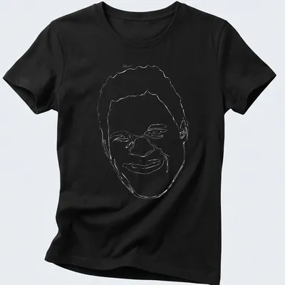 Bold graphic tee featuring Mark Kerr, The Smashing Machine in red, black, and white — printed on a women's shirt
