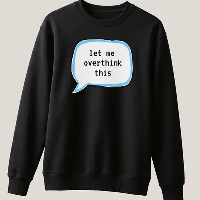 Cartoon thought bubble with the text 'let me overthink this' in light blue and black — printed on a unisex sweatshirt