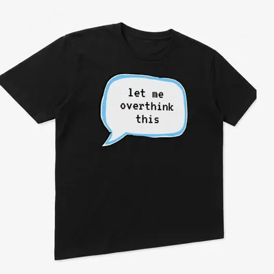 Cartoon thought bubble with the text 'let me overthink this' in light blue and black — printed on a unisex t-shirt (angled view)