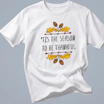 Hand-drawn illustration of autumn leaves and acorns with text 'TIS THE SEASON TO BE THANKFUL'