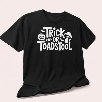 Cartoon-style T-shirt featuring a whimsical toadstool and playful lettering — printed on a unisex t-shirt (angled view)
