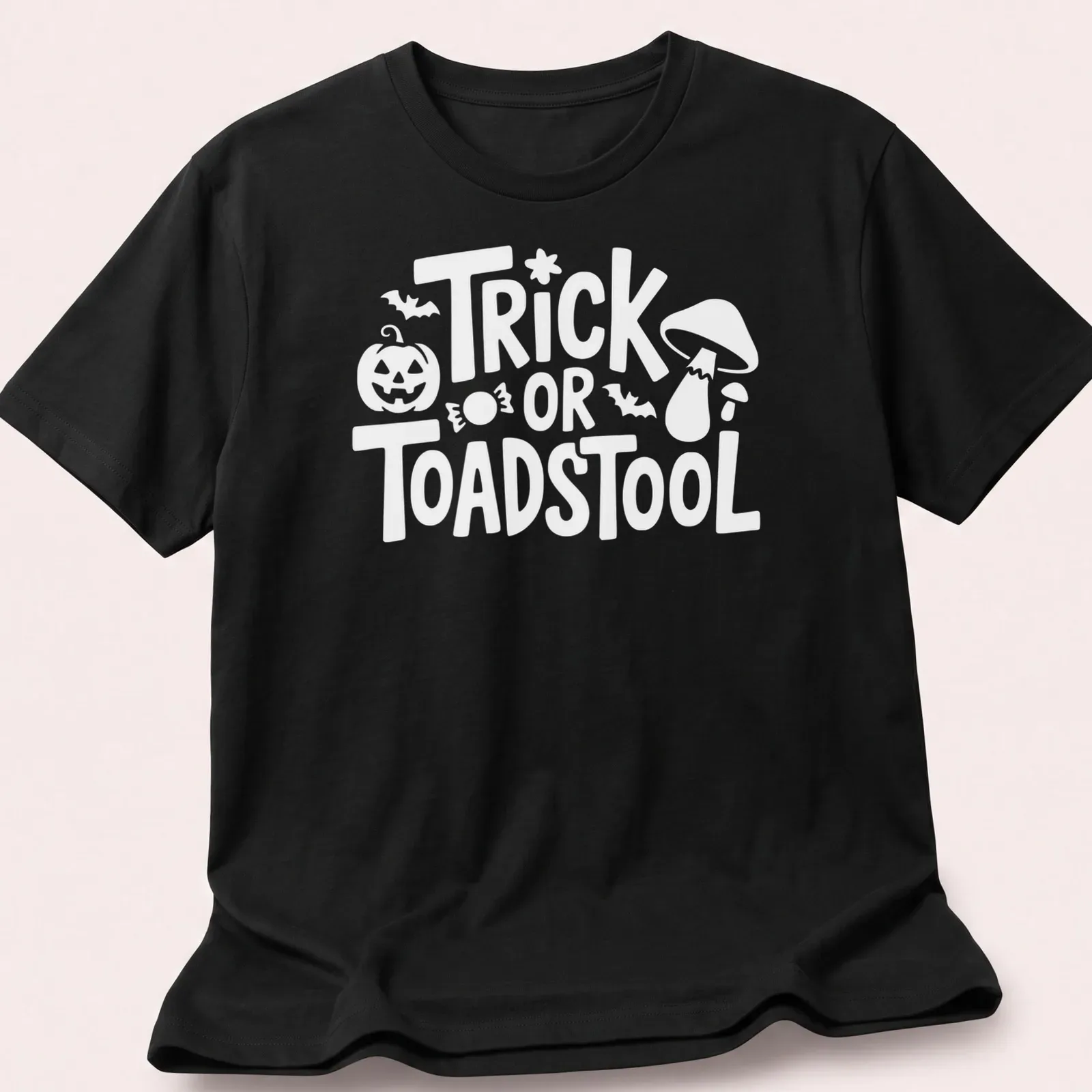 Cartoon-style T-shirt featuring a whimsical toadstool and playful lettering — printed on a unisex t-shirt