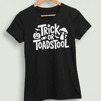Cartoon-style T-shirt featuring a whimsical toadstool and playful lettering — printed on a women's shirt