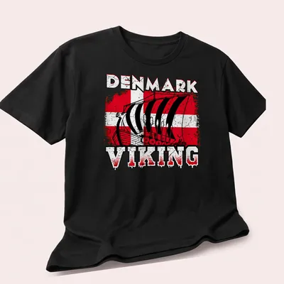 Distressed Viking ship graphic with Denmark flag colors and bold text — printed on a unisex t-shirt (angled view)