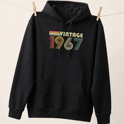 Vintage distressed t-shirt featuring 'VINTAGE 1967' in a retro font — printed on a unisex hoodie
