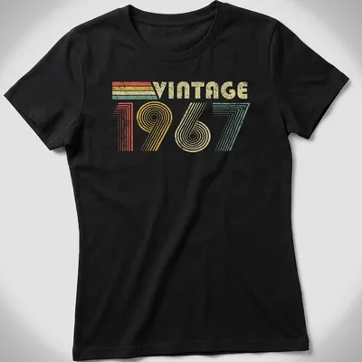 Vintage distressed t-shirt featuring 'VINTAGE 1967' in a retro font — printed on a women's shirt