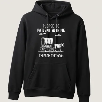 Vintage western design featuring a wagon with oxen and humorous text about patience — printed on a unisex hoodie