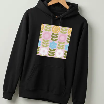 Illustration of wildflowers in pink, yellow, green, blue, and white in a mod Scandi style — printed on a unisex hoodie