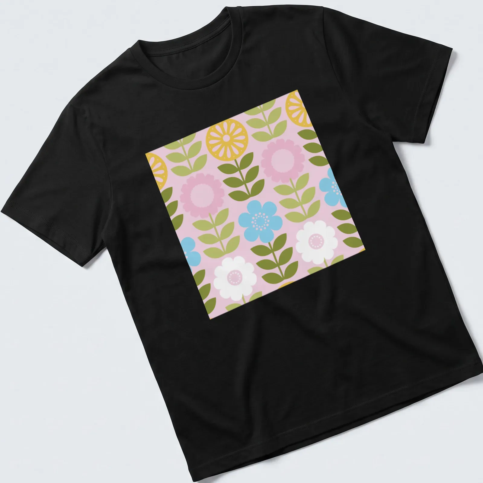 Illustration of wildflowers in pink, yellow, green, blue, and white in a mod Scandi style — printed on a unisex t-shirt
