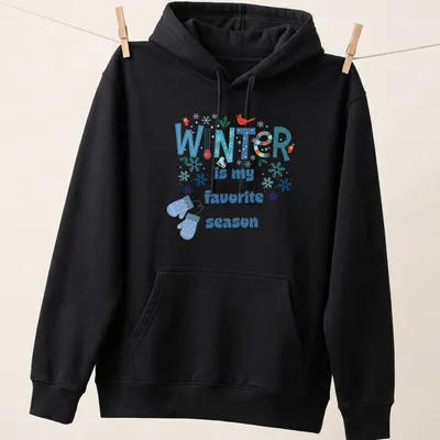 Colorful winter-themed T-shirt featuring snowflakes and mittens with the text 'WINTER is my favorite season' — printed on a unisex hoodie