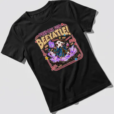 Cartoon wizard goat design with colorful text and whimsical style — printed on a women's shirt