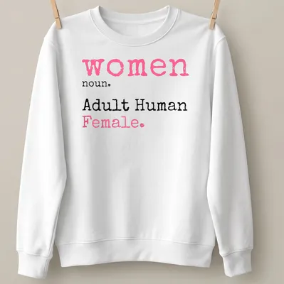 Playful typography t-shirt defining 'women noun. Adult Human Female.' in pink, black, and white. — printed on a unisex sweatshirt