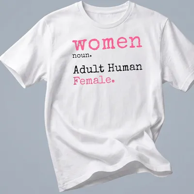 Playful typography t-shirt defining 'women noun. Adult Human Female.' in pink, black, and white.